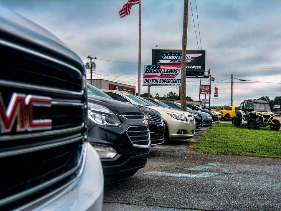 Vehicles in a line on the Jason Lewis Knoxville Supercenter lot